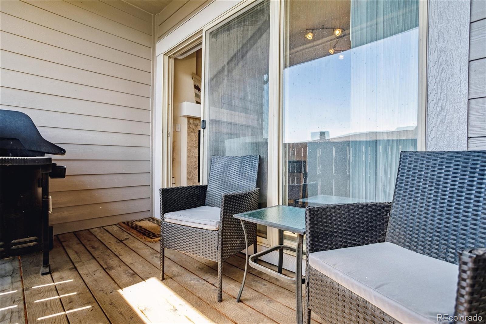 9370 Las Ramblas Court, Unit R Parker, CO 80134 - Photo 28 of 39 a view of a patio with wooden floor