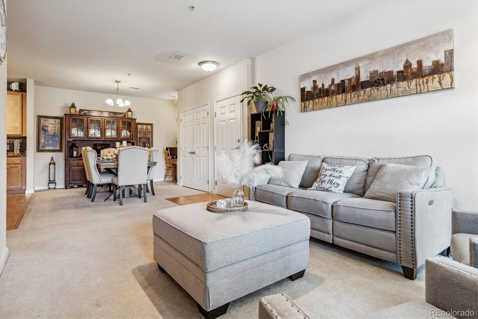 9370 Las Ramblas Court, Unit R Parker, CO 80134 - Photo 37 of 39 a living room with furniture and kitchen view
