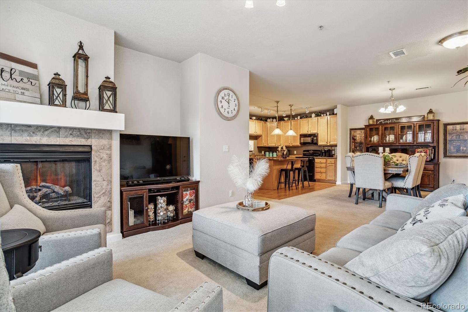 9370 Las Ramblas Court, Unit R Parker, CO 80134 - Photo 7 of 39 a living room with furniture and a flat screen tv
