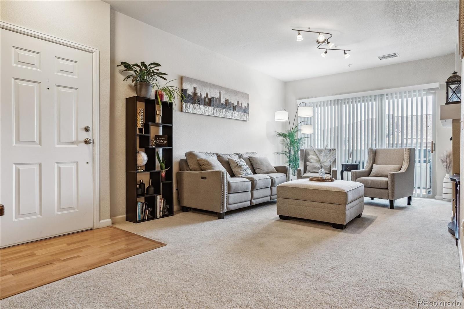 9370 Las Ramblas Court, Unit R Parker, CO 80134 - Photo 9 of 39 a living room with furniture and a window