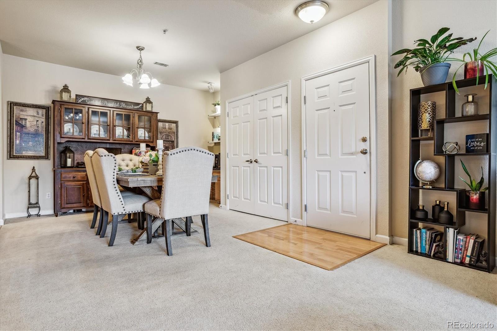 9370 Las Ramblas Court, Unit R Parker, CO 80134 - Photo 10 of 39 a view of a livingroom with furniture and a bookshelf