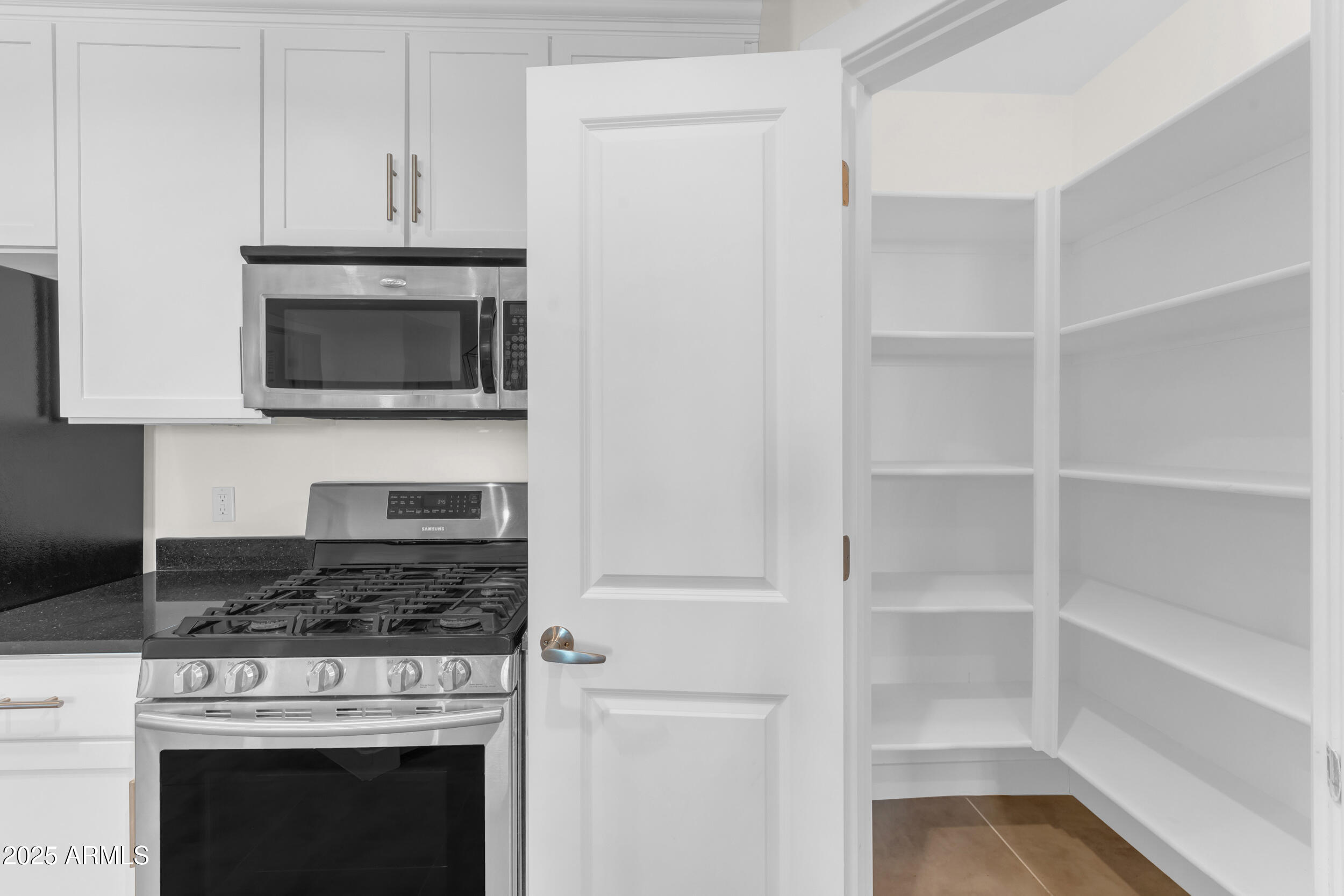 945 East Playa Del Norte Drive, Unit 5005 Tempe, AZ 85288 - Photo 16 of 69 a kitchen with cabinets and appliances