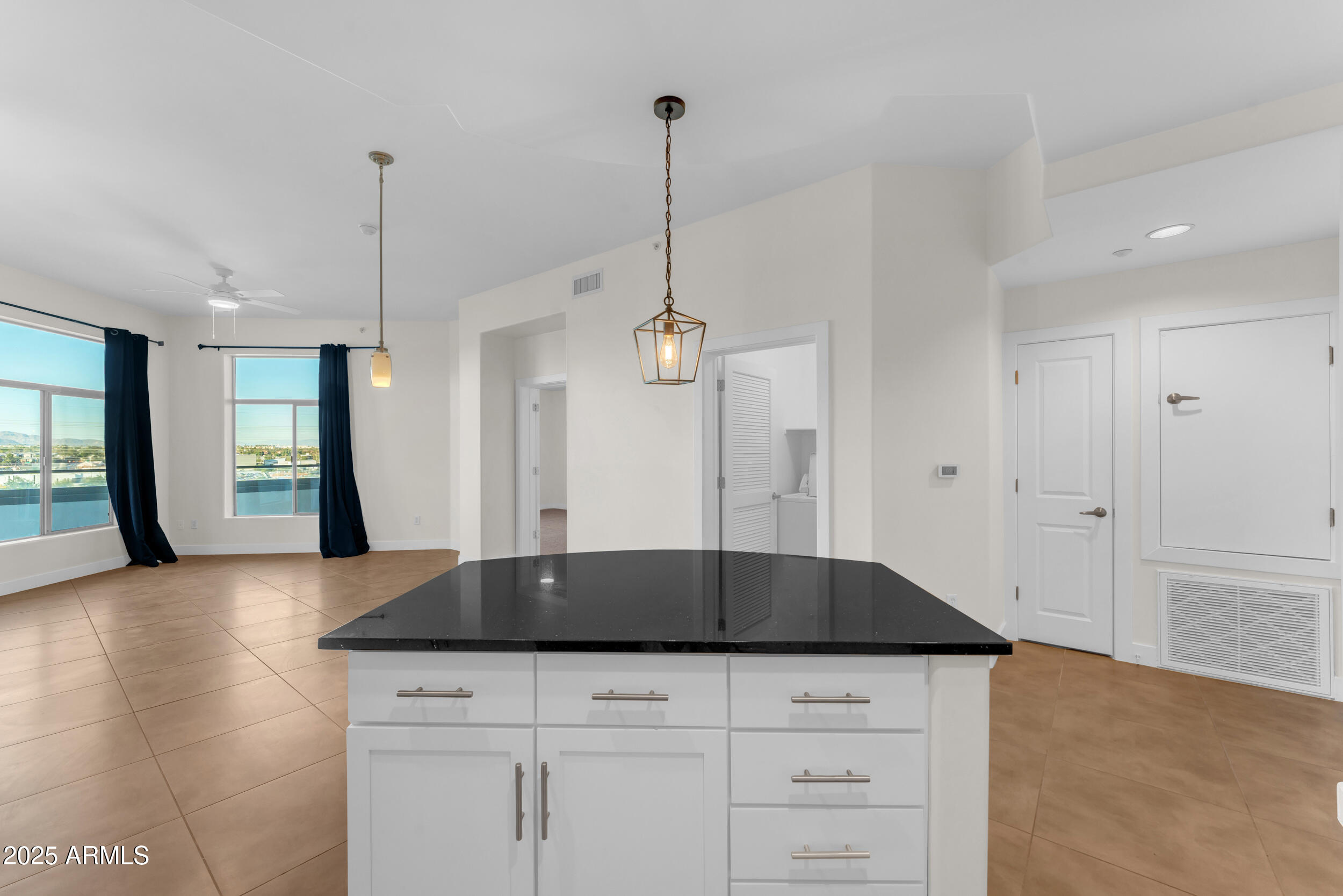 945 East Playa Del Norte Drive, Unit 5005 Tempe, AZ 85288 - Photo 17 of 69 a kitchen with granite countertop a sink a refrigerator and a stove