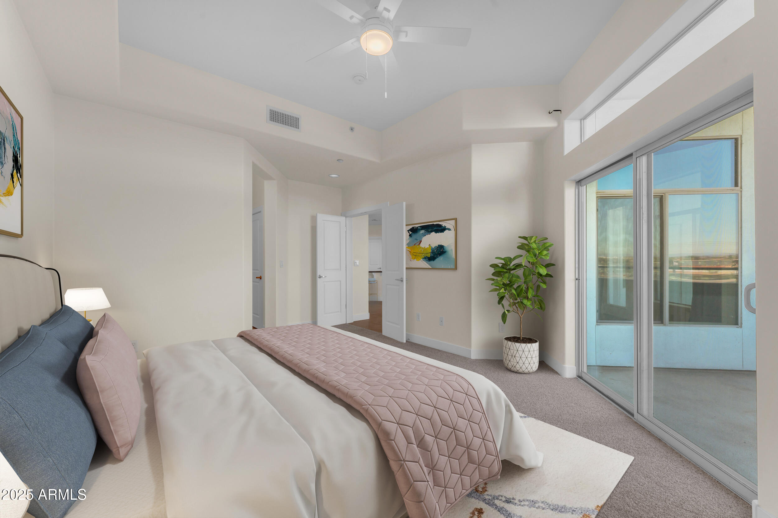 945 East Playa Del Norte Drive, Unit 5005 Tempe, AZ 85288 - Photo 24 of 69 a bedroom with a bed and a potted plant