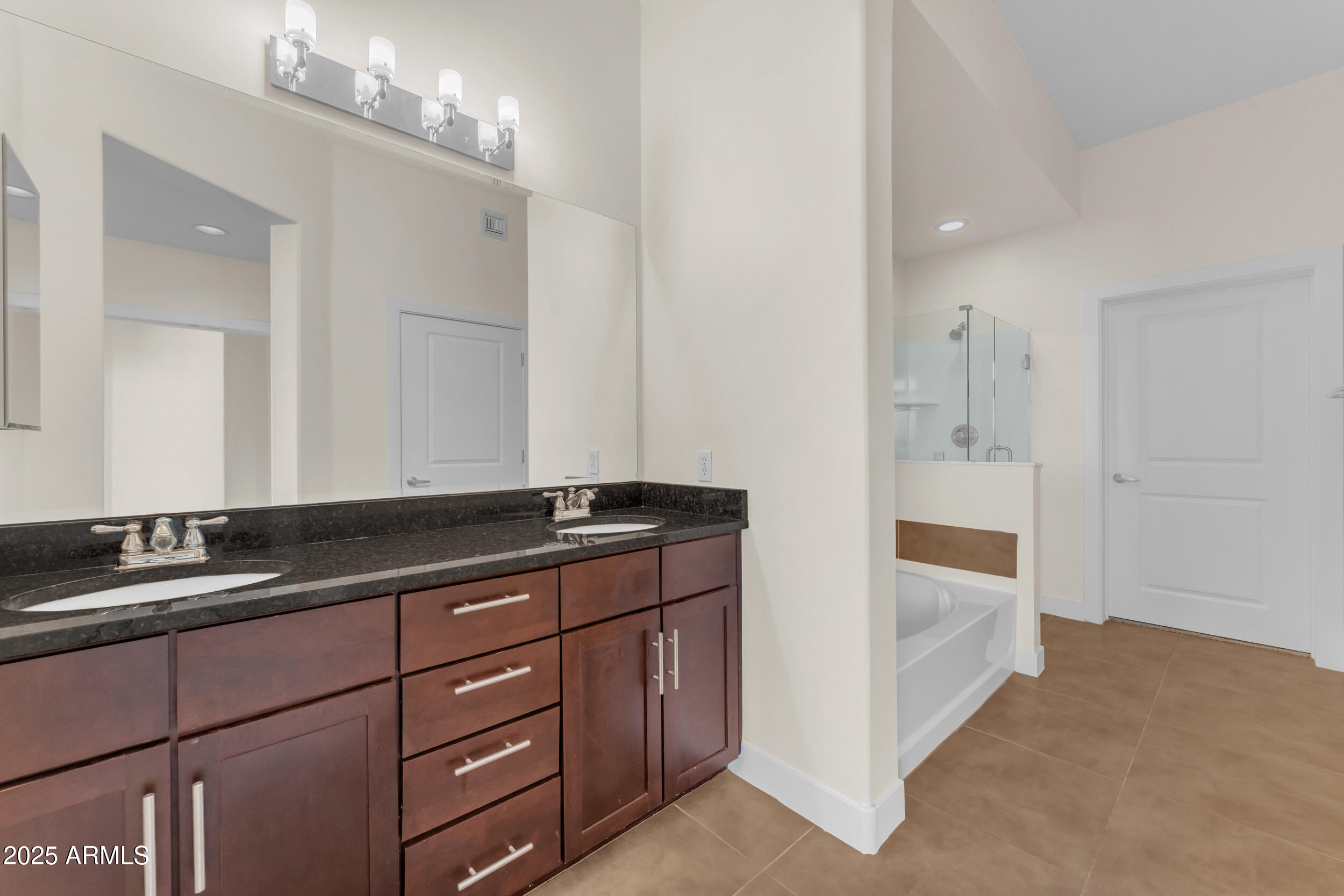 945 East Playa Del Norte Drive, Unit 5005 Tempe, AZ 85288 - Photo 28 of 69 a bathroom with double vanity and a mirror