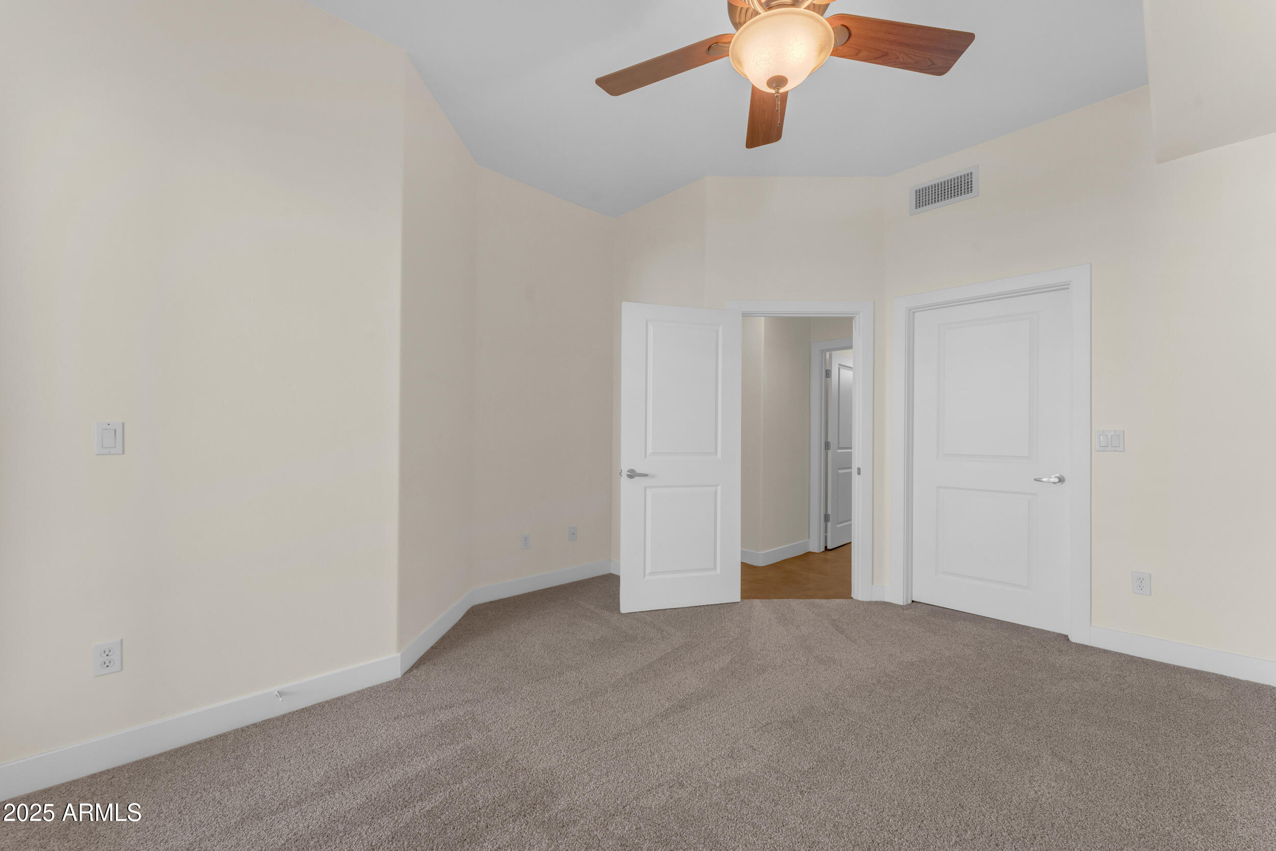 945 East Playa Del Norte Drive, Unit 5005 Tempe, AZ 85288 - Photo 35 of 69 a view of an empty room and a chandelier fan