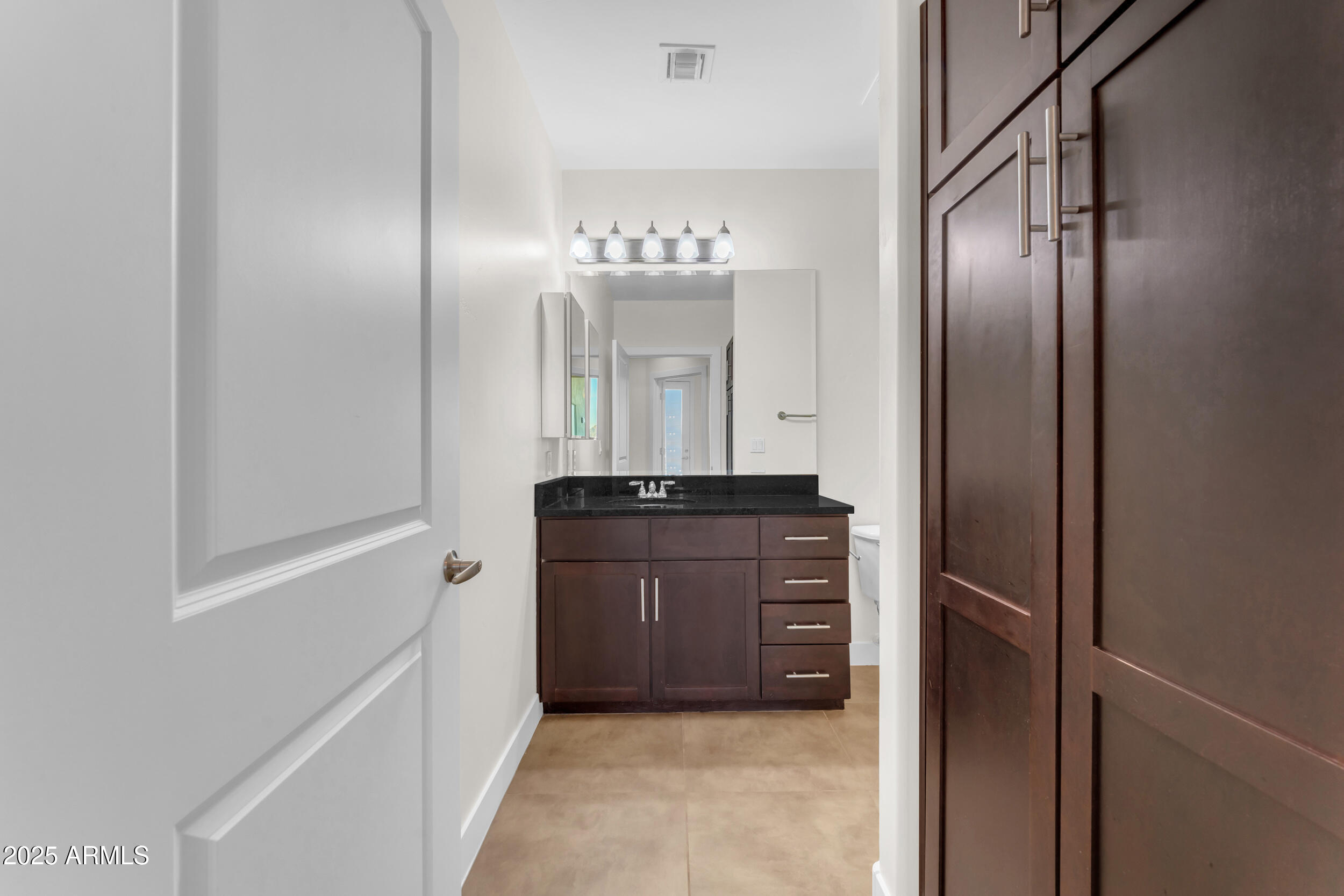 945 East Playa Del Norte Drive, Unit 5005 Tempe, AZ 85288 - Photo 38 of 69 a bathroom with a sink and a mirror
