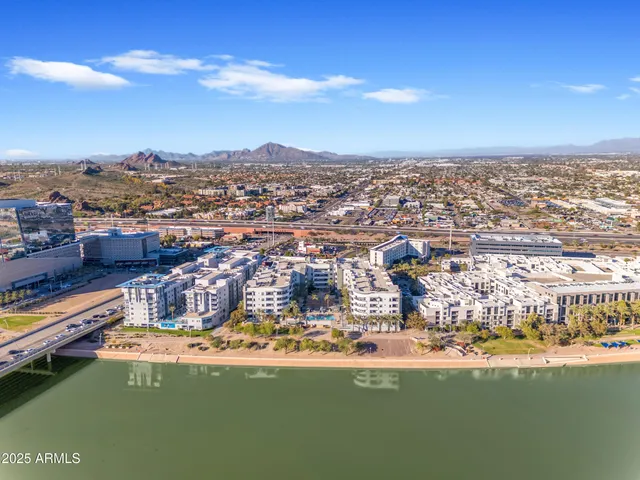 a view of a parking area and a cars park side of a road