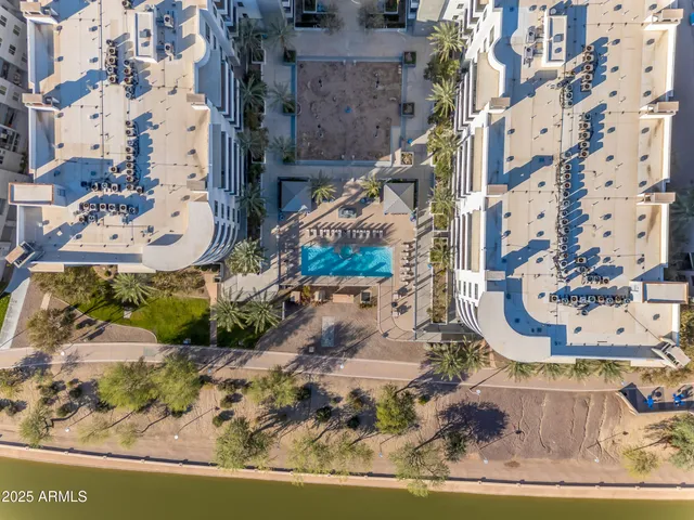a view of a swimming pool with outdoor seating