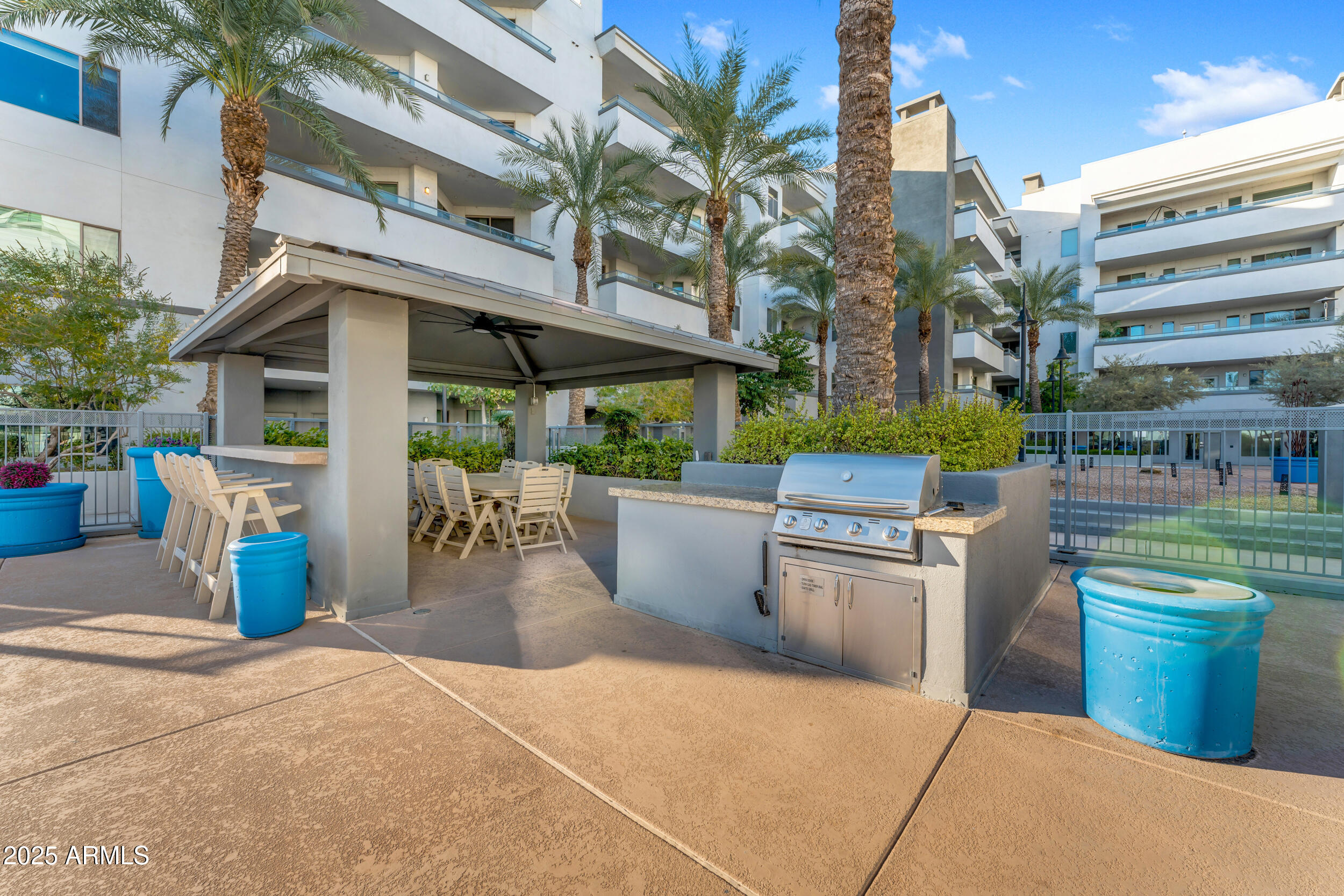 945 East Playa Del Norte Drive, Unit 5005 Tempe, AZ 85288 - Photo 65 of 69 a view of a patio with a chairs and table in a patio