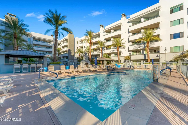 a view of swimming pool with outdoor seating