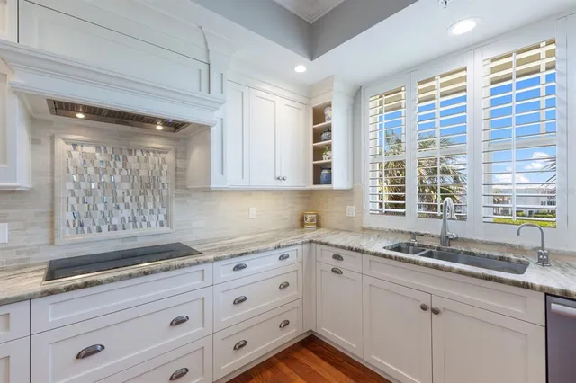 a living room with furniture hard wood floor and a window