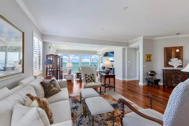 a bedroom with a bed wooden floor and window