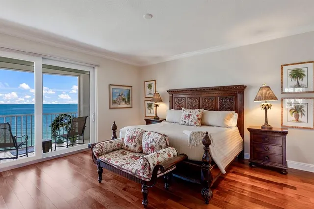 a view of a balcony with chair and floor to ceiling window
