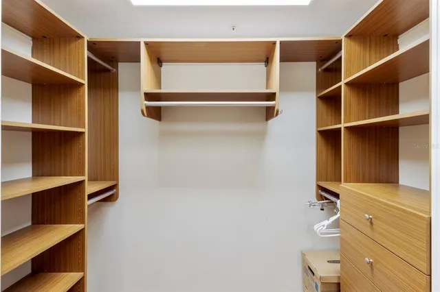 a bedroom with bed and a night stand