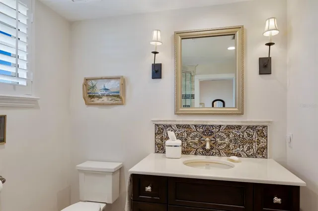 an aerial view of a swimming pool with a garden and plants