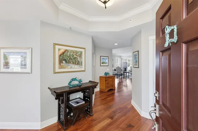 a kitchen with granite countertop white cabinets and window