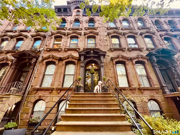 a street view of building with yard