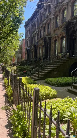 a kitchen with a sink cabinets and wooden floor
