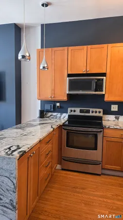 a view of a livingroom with furniture and a fireplace