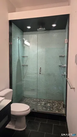 a bathroom with a sink a mirror and a vanity