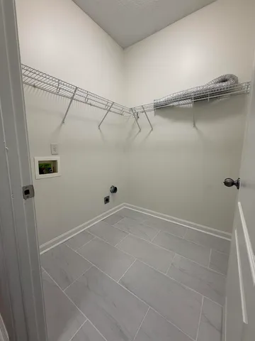 a view of a room with racks on the wall