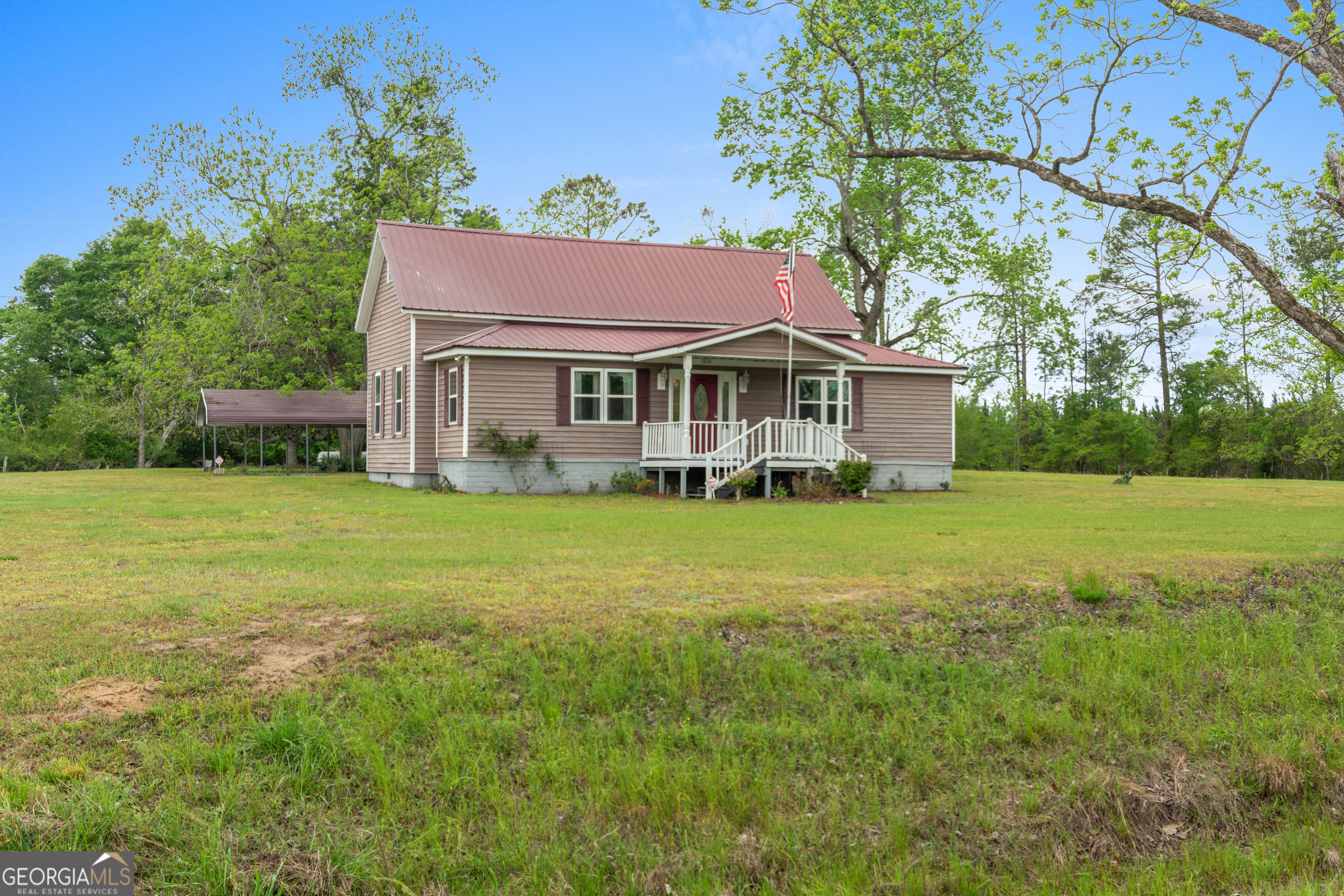 2010 Page Road Harrison, GA 31035 - Photo 11 of 59 a front view of house with yard and green space