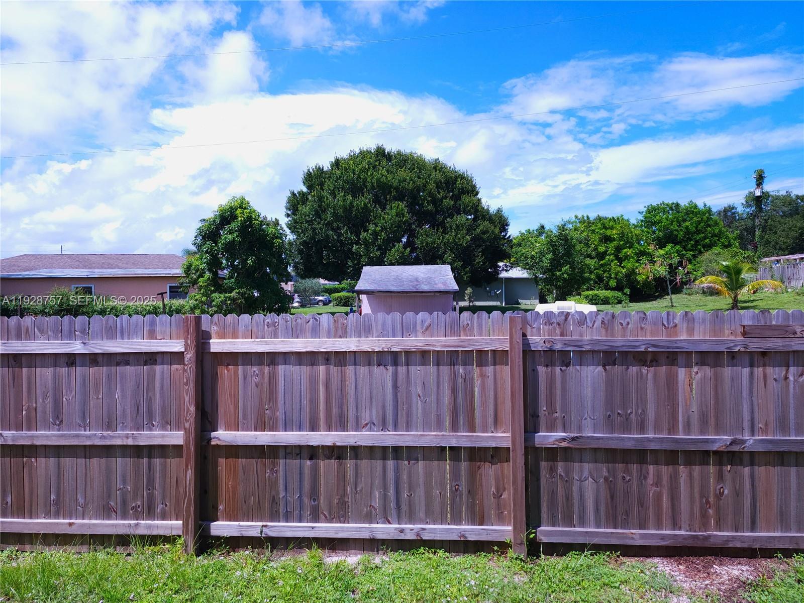 720 2nd Place Southwest Vero Beach, FL 32962 - Photo 15 of 44 a view of a wooden fence