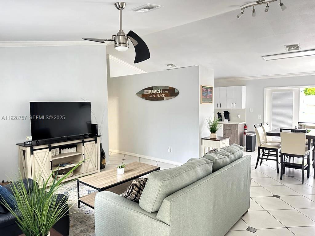 720 2nd Place Southwest Vero Beach, FL 32962 - Photo 16 of 44 a living room with furniture and a flat screen tv