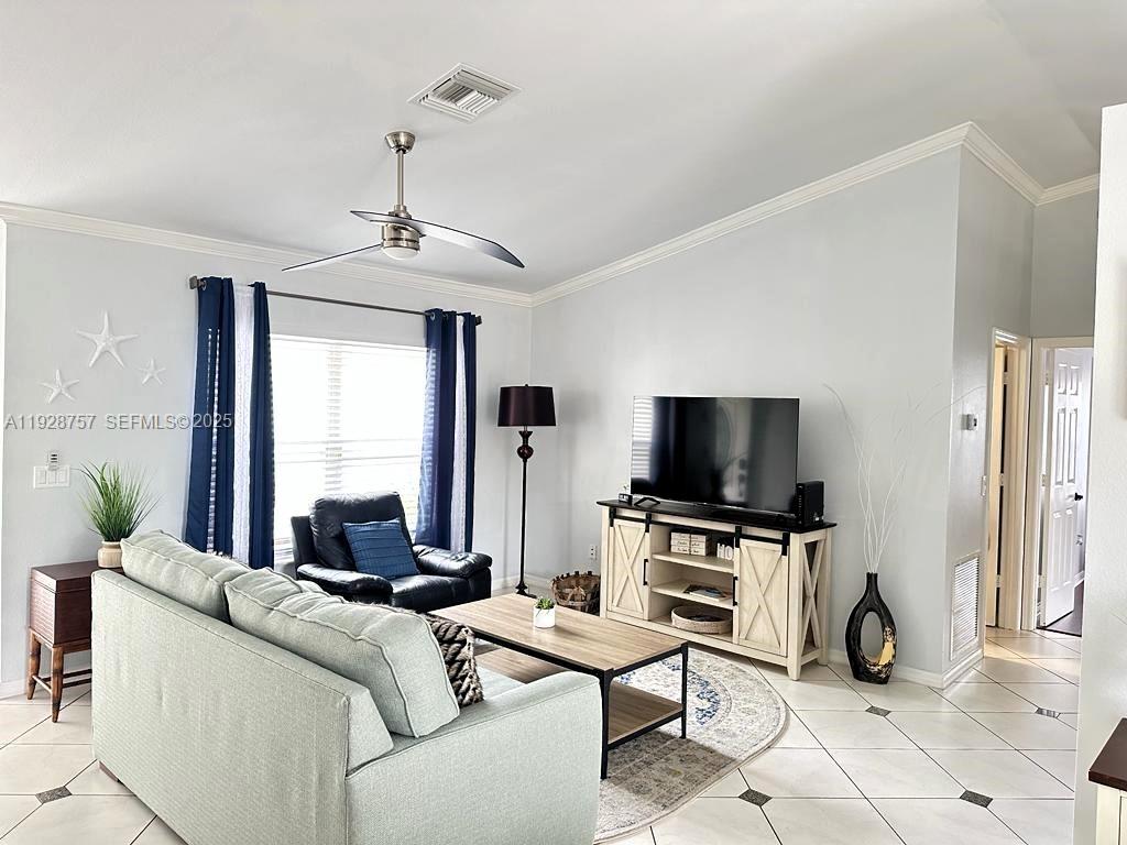 720 2nd Place Southwest Vero Beach, FL 32962 - Photo 17 of 44 a living room with furniture and a flat screen tv