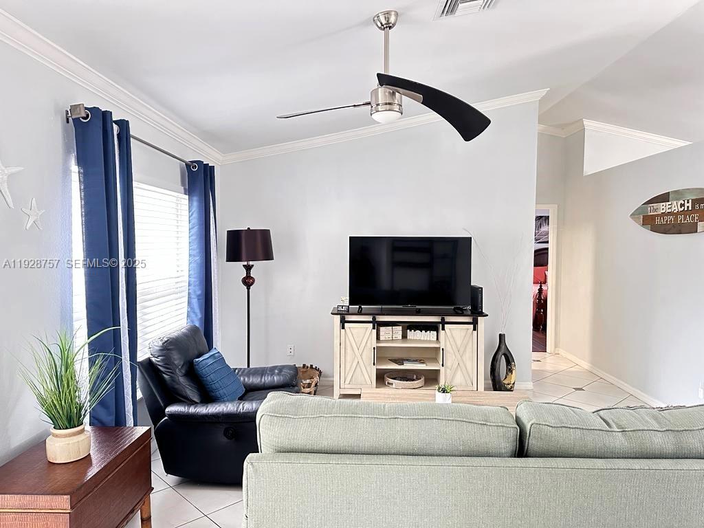 720 2nd Place Southwest Vero Beach, FL 32962 - Photo 18 of 44 a living room with furniture and a flat screen tv