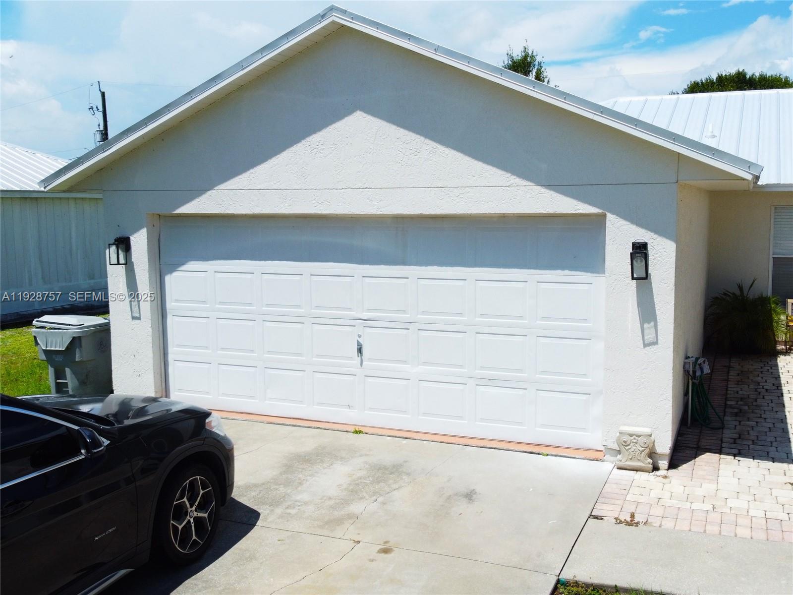 720 2nd Place Southwest Vero Beach, FL 32962 - Photo 2 of 44 a car parked in front of a house