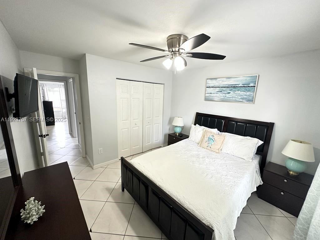 720 2nd Place Southwest Vero Beach, FL 32962 - Photo 27 of 44 a bedroom with a bed and a mirror
