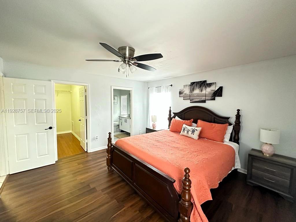 720 2nd Place Southwest Vero Beach, FL 32962 - Photo 31 of 44 a bedroom with a bed and wooden floor