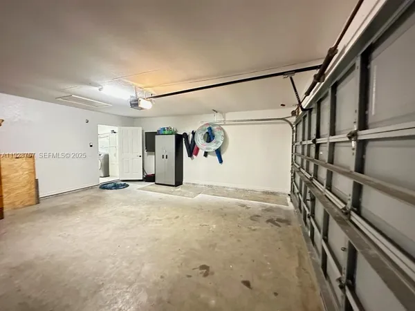 a view of a garage with stairs