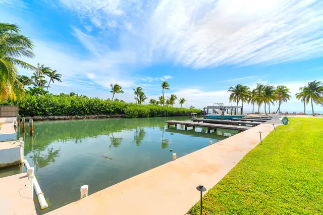 a bath tub sitting in a bathroom next to a window