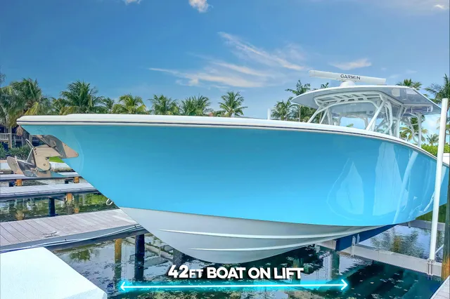 a spacious bathroom with a granite countertop sink and mirror