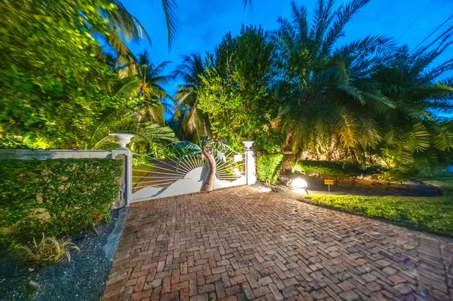 a living room with furniture and dining table with wooden floor