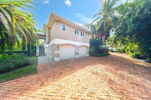 a bedroom with a bed and a television