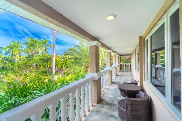 a bathroom with a granite countertop sink mirror and shower