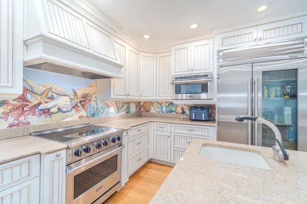 a view of a lake with houses in the back