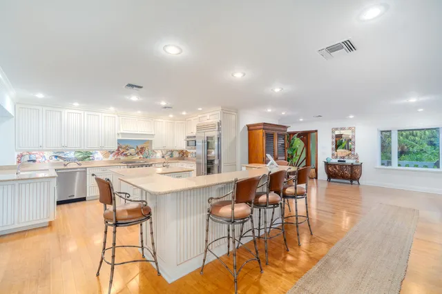 a view of a lake with palm trees