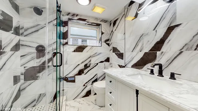 a view of a kitchen with a sink and cabinets