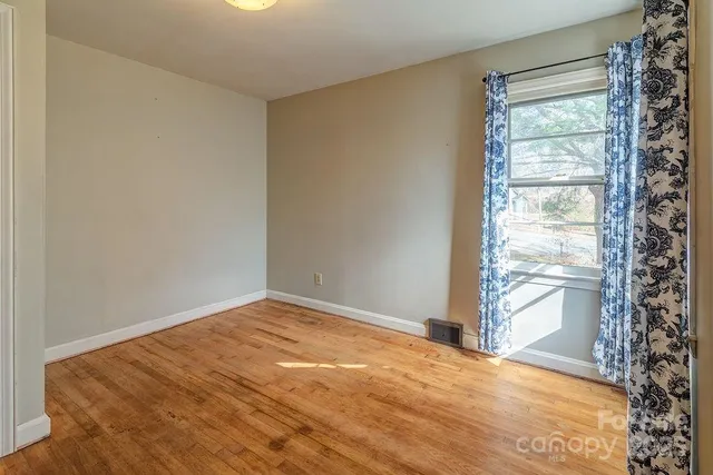 a view of an empty room and window