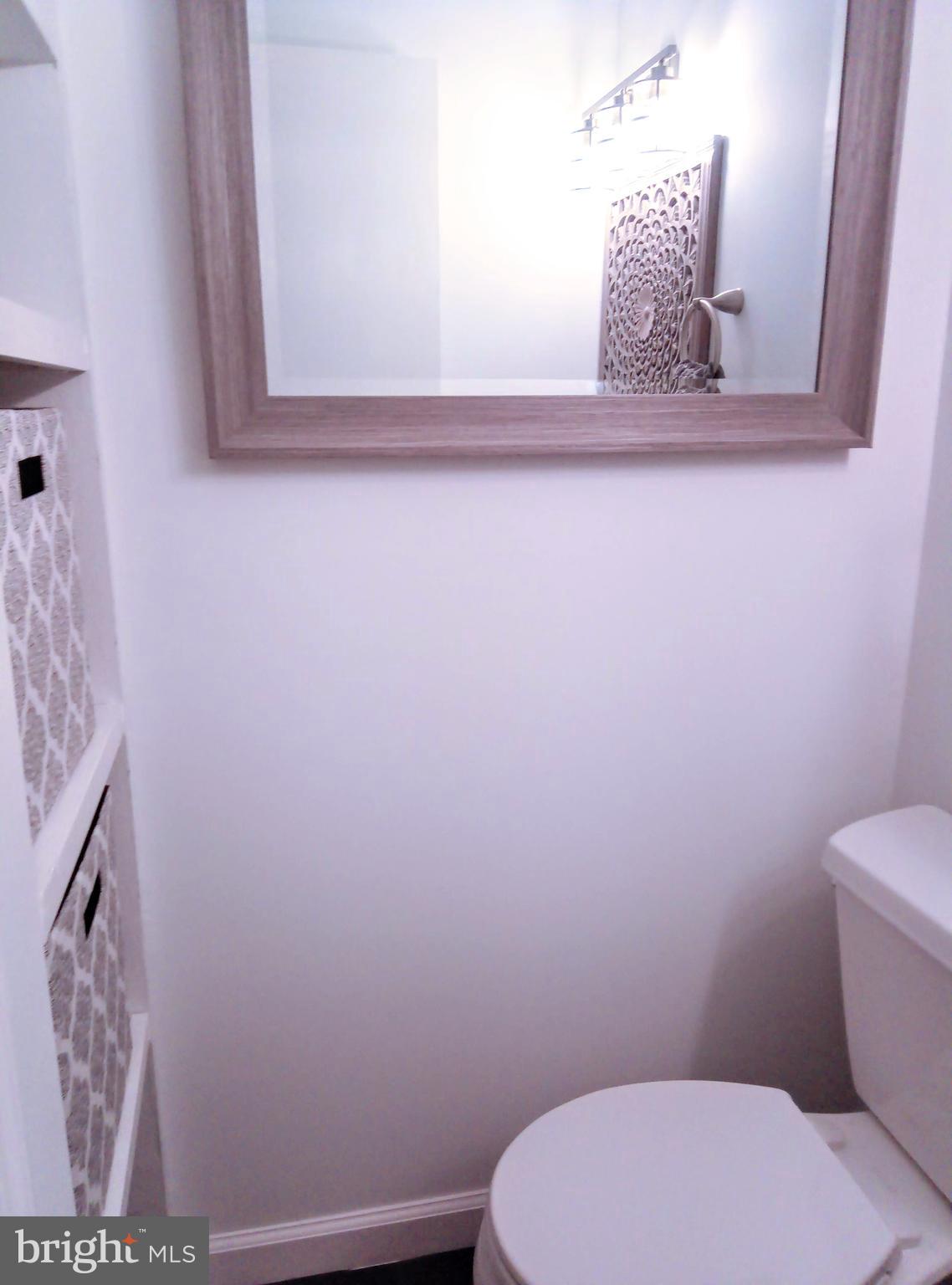 2795 York Rd. Jamison, PA 18929 - Photo 35 of 39 a bathroom with a toilet sink and mirror