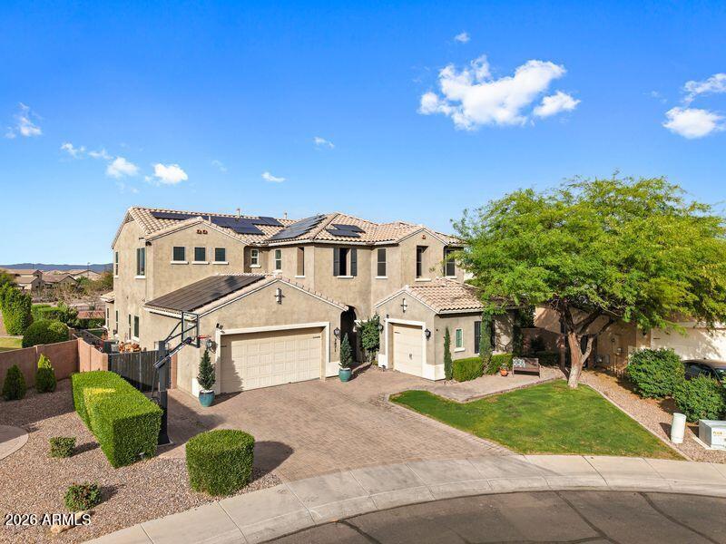 7871 South Stuart Avenue Gilbert, AZ 85298 - Photo 42 of 77 a view of a white house with a yard