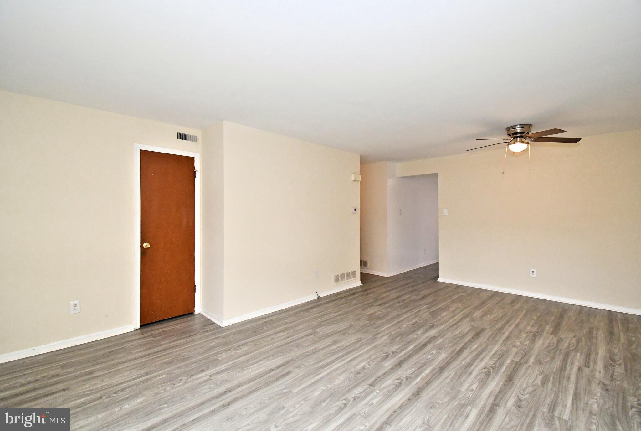 592 A Wrensong Road, Unit A Yardley, PA 19067 - Photo 2 of 36 a view of an empty room with wooden floor