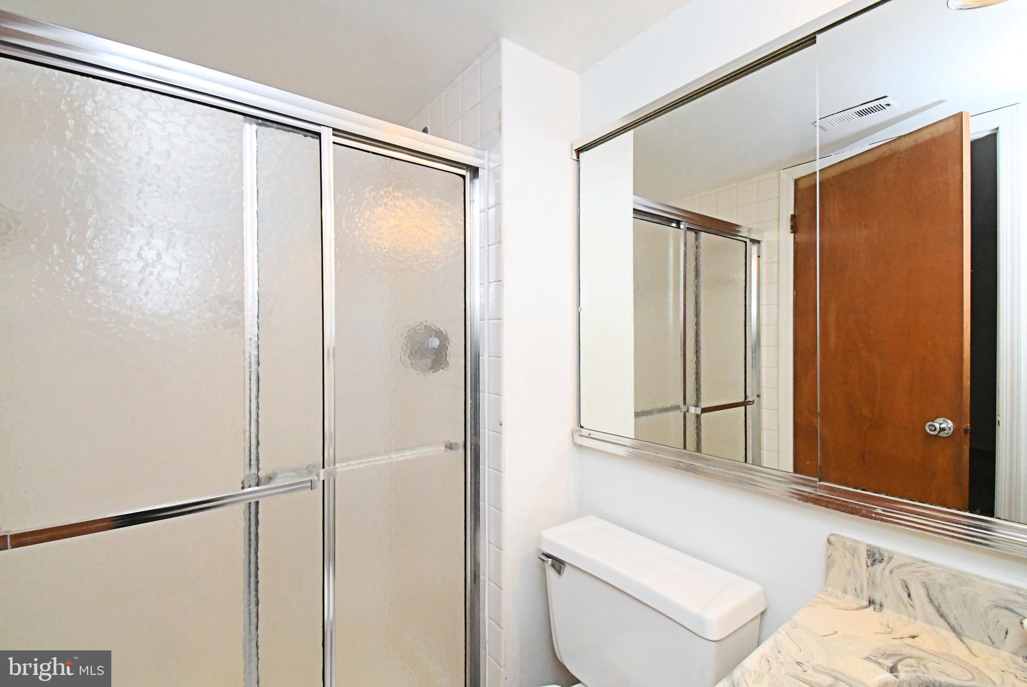 592 A Wrensong Road, Unit A Yardley, PA 19067 - Photo 21 of 36 a bathroom with a shower a toilet and a sink
