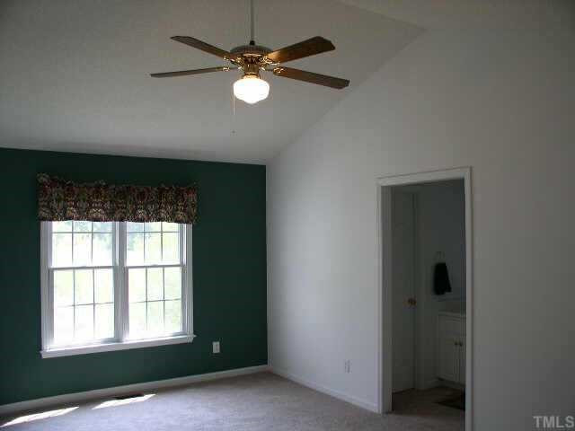 145 Ridge Way Lane Clayton, NC 27520 - Photo 3 of 8 Master Bedroom has cathedral ceiling with fan and painted accent wall Other
