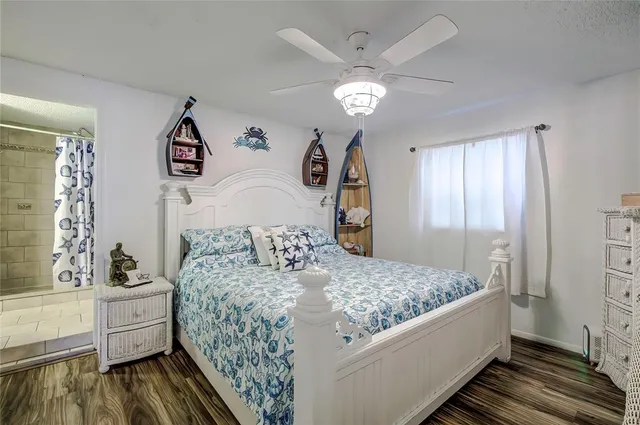 a bedroom with a bed and a view of bathroom
